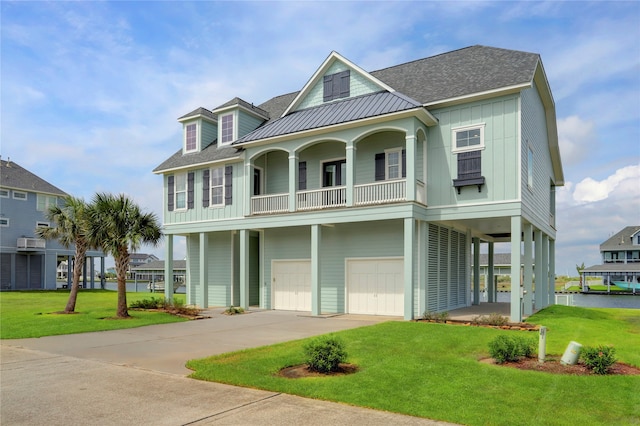 beach home with a garage and a front yard