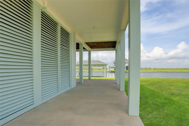 view of patio with a water view