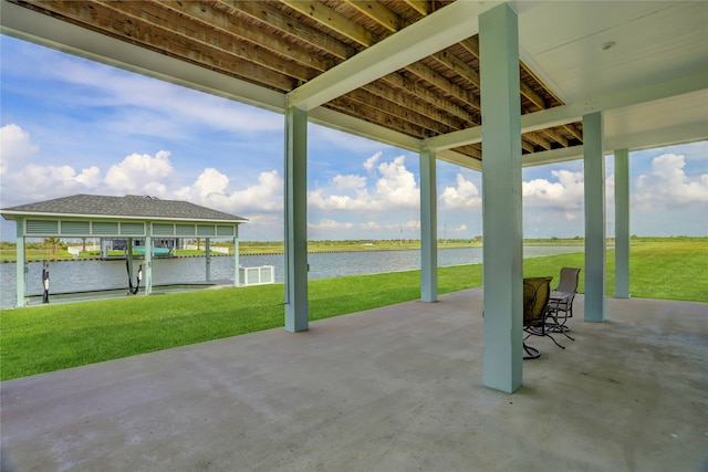 view of patio / terrace featuring a water view and a dock