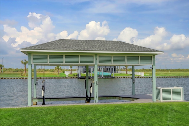 dock area with a water view and a lawn