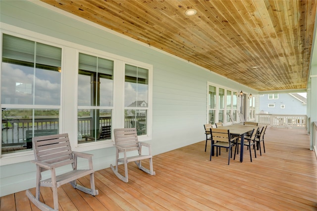 deck featuring a water view and french doors