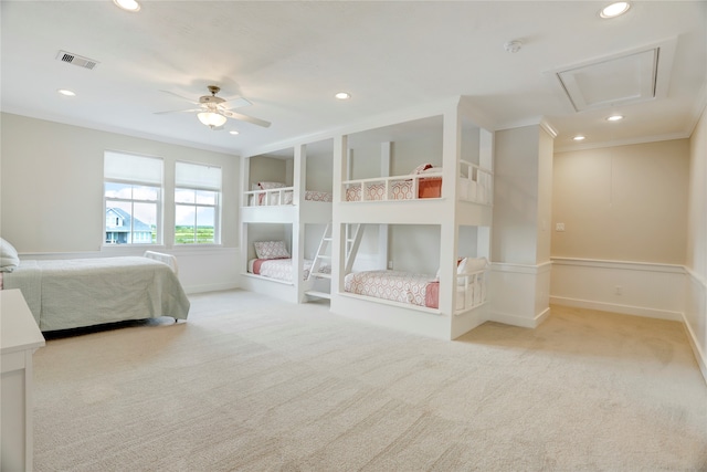 bedroom featuring ceiling fan, light carpet, and crown molding