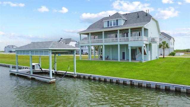 rear view of house featuring cooling unit, a yard, a water view, and a patio area