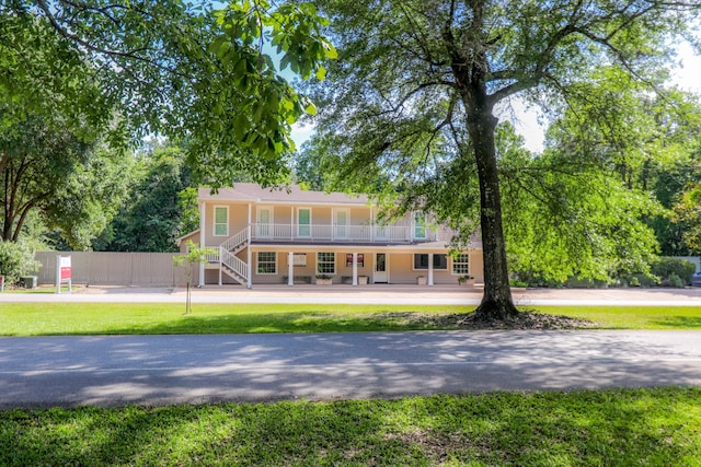 back of property with covered porch