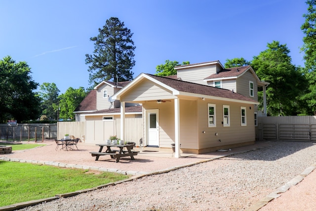 view of front of home featuring ceiling fan and a patio