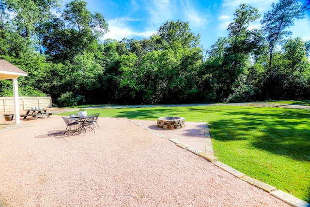 exterior space with a patio and an outdoor fire pit