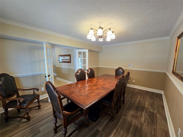 dining room featuring french doors, dark hardwood / wood-style flooring, a textured ceiling, crown molding, and a chandelier