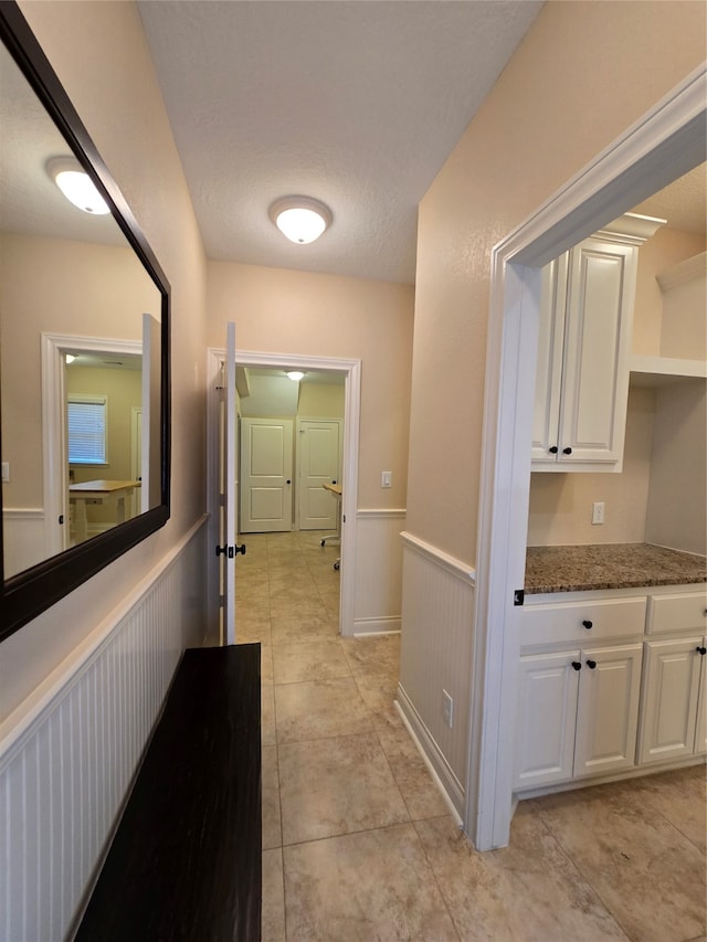 hallway with light tile patterned flooring