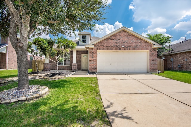 view of front of home with a garage and a front yard