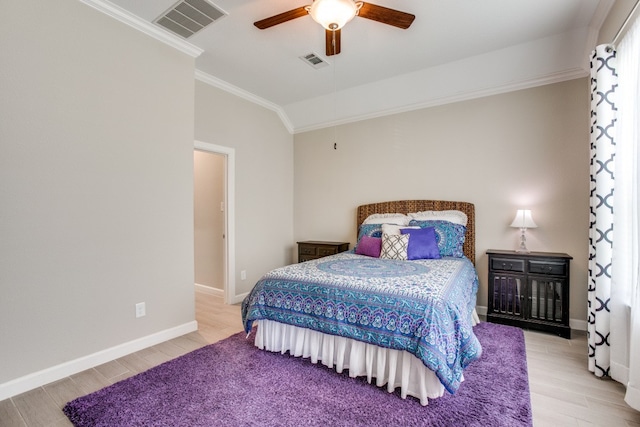 bedroom featuring ceiling fan, lofted ceiling, ornamental molding, and light hardwood / wood-style floors