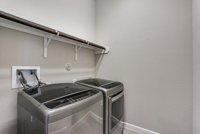 laundry room featuring independent washer and dryer