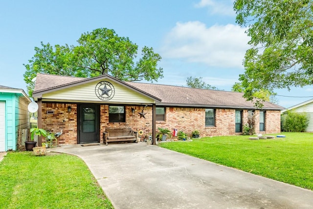 131 Bastrop Bayou Dr, Angleton, TX 77515 - ranch-style house featuring driveway, brick siding, covered porch, a front yard, and roof with shingles