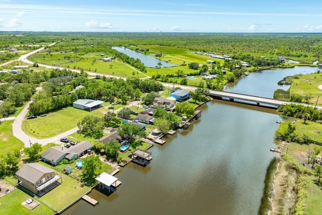 131 Bastrop Bayou Dr, Angleton, TX 77515 - birds eye view of property with a water view and a view of trees
