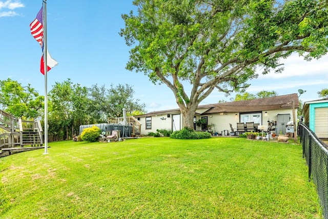 131 Bastrop Bayou Dr, Angleton, TX 77515 - view of yard featuring fence, stairs, and a wooden deck