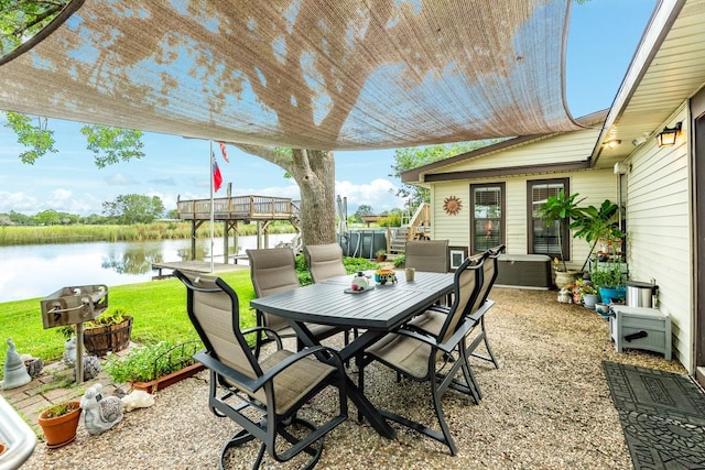 131 Bastrop Bayou Dr, Angleton, TX 77515 - view of patio / terrace featuring outdoor dining area and a water view
