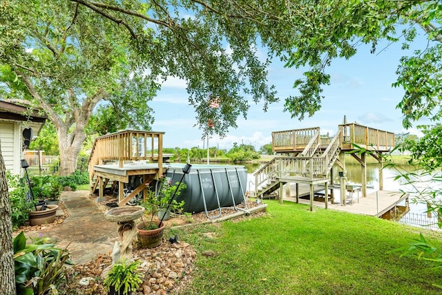 131 Bastrop Bayou Dr, Angleton, TX 77515 - view of yard featuring stairs, an outdoor pool, and a deck with water view