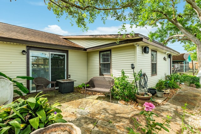 back of property with a patio