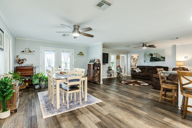 dining area with ceiling fan, dark hardwood / wood-style floors, crown molding, and french doors