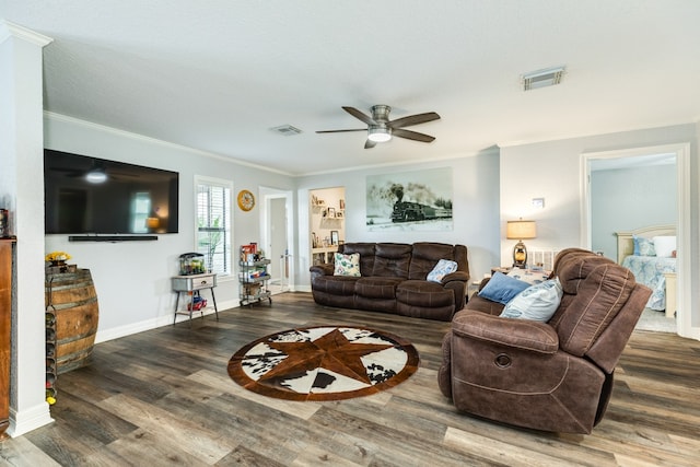 living room featuring ceiling fan, crown molding, and hardwood / wood-style flooring