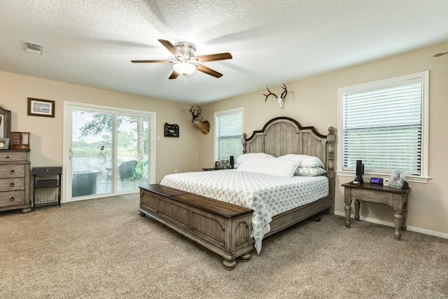 131 Bastrop Bayou Dr, Angleton, TX 77515 - bedroom featuring light colored carpet, multiple windows, access to outside, and a ceiling fan