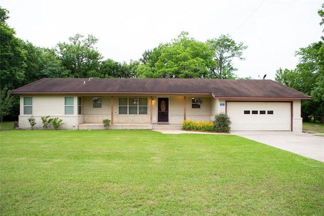 ranch-style home with a garage, covered porch, and a front yard