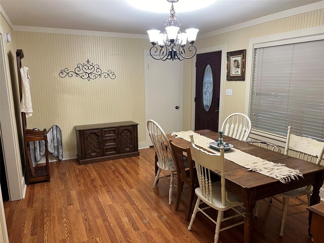 121 N Hauptstrasse St, Carmine, TX 78932 - dining area featuring ornamental molding, a chandelier, wood finished floors, and baseboards