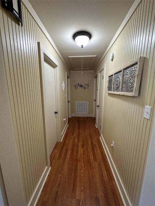 corridor with dark hardwood / wood-style floors