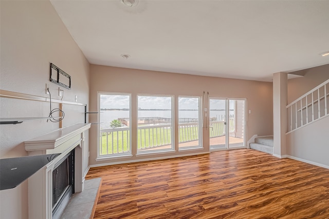 unfurnished living room featuring light hardwood / wood-style flooring