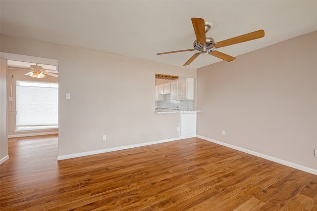 unfurnished room featuring wood-type flooring and ceiling fan