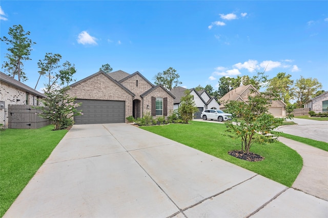 view of front of home featuring a front lawn and a garage