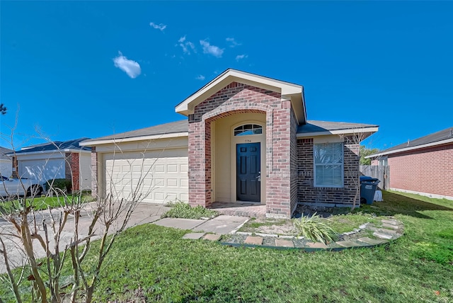 view of front of home with a front yard and a garage