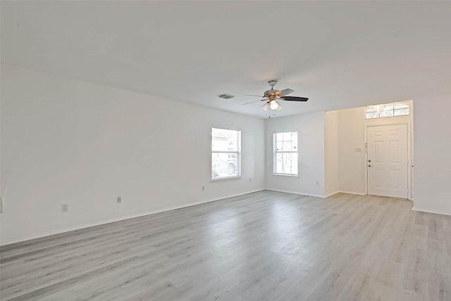 spare room with light hardwood / wood-style flooring and ceiling fan