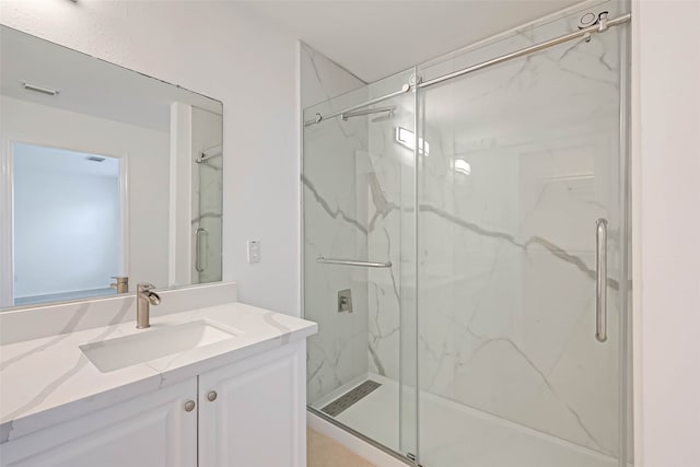 bathroom with vanity and an enclosed shower