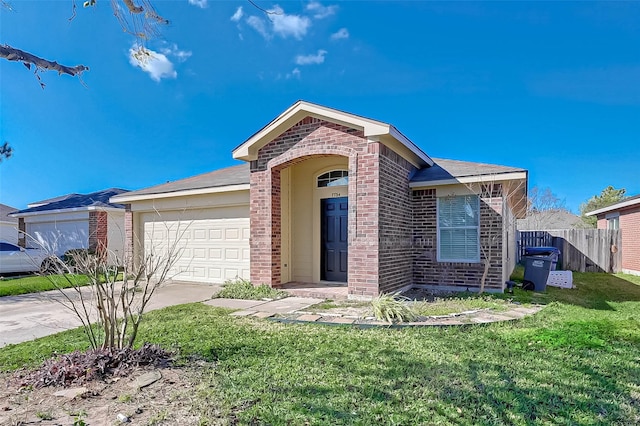 single story home with a garage and a front lawn