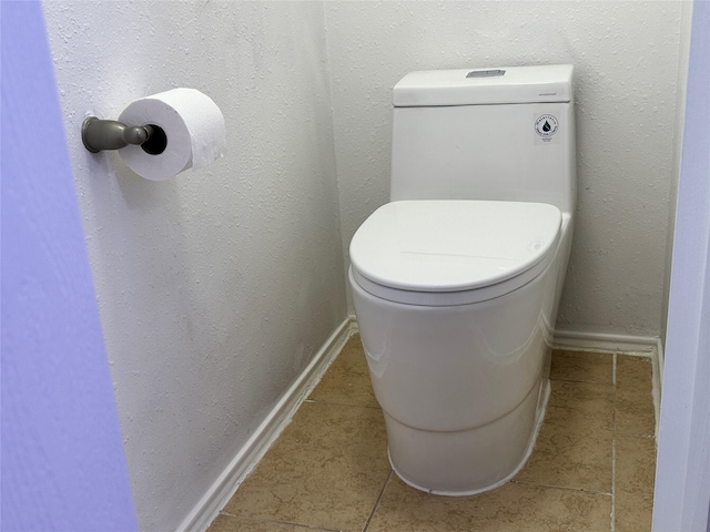 bathroom featuring tile patterned floors and toilet