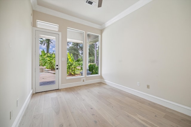 unfurnished room with ceiling fan, light wood-type flooring, ornamental molding, and a healthy amount of sunlight