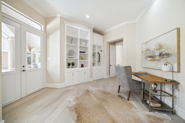 home office featuring light hardwood / wood-style flooring and ornamental molding