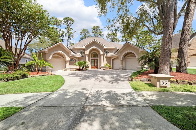 view of front of property with a garage