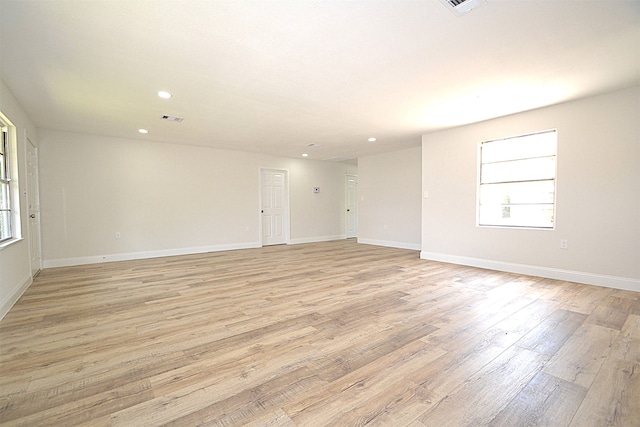 unfurnished room featuring light hardwood / wood-style floors