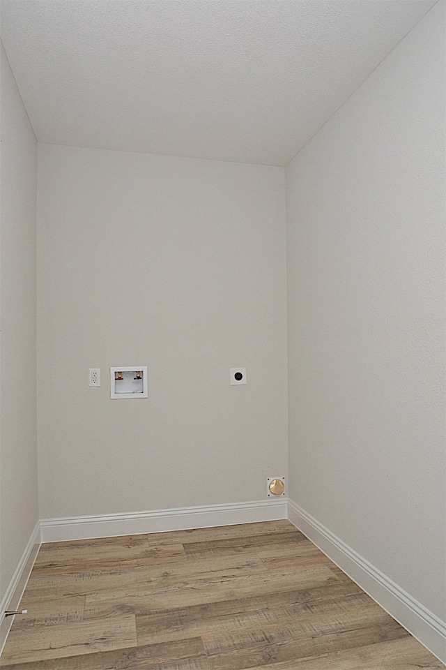 laundry area featuring light hardwood / wood-style flooring, hookup for a washing machine, and hookup for an electric dryer