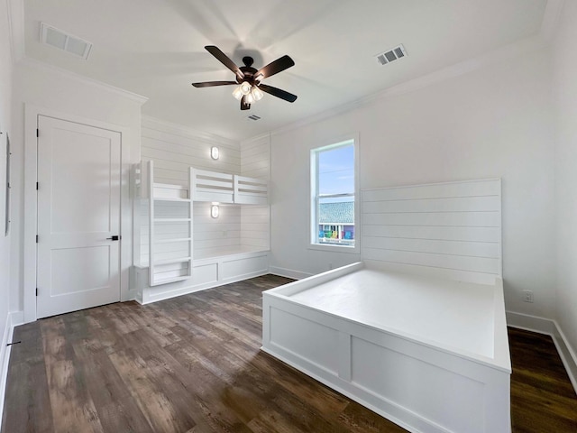 unfurnished bedroom with ceiling fan, dark hardwood / wood-style flooring, and crown molding