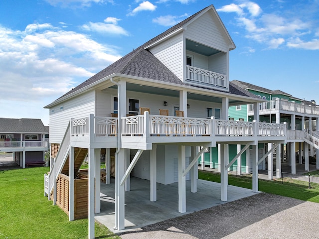 back of house with a wooden deck and a yard