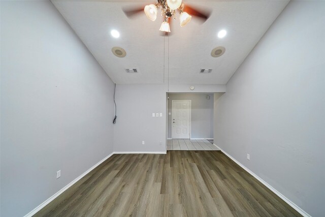 spare room featuring ceiling fan and hardwood / wood-style flooring