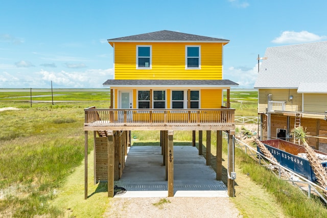 view of front of house featuring a rural view and a carport