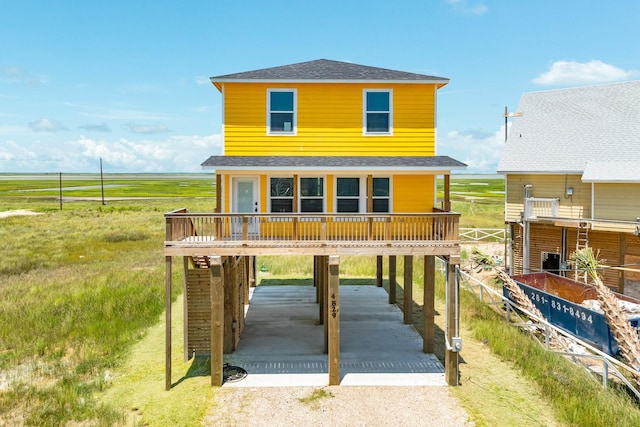 view of front of house featuring a carport and a rural view