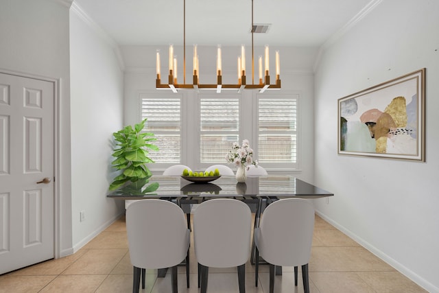 dining area with light tile patterned flooring, ornamental molding, an inviting chandelier, and a healthy amount of sunlight