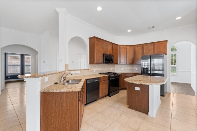 kitchen featuring crown molding, black appliances, light tile patterned flooring, tasteful backsplash, and sink