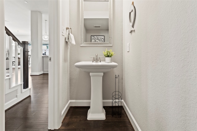 bathroom with wood-type flooring and sink