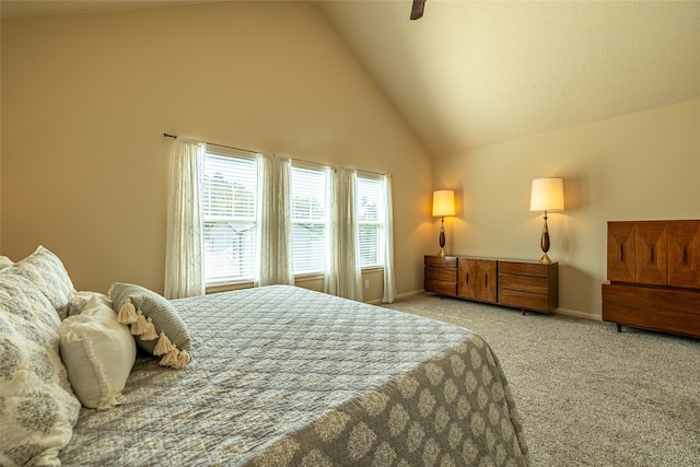 carpeted bedroom featuring ceiling fan and high vaulted ceiling