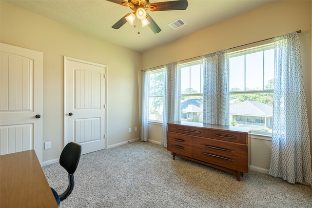 office featuring light carpet and ceiling fan